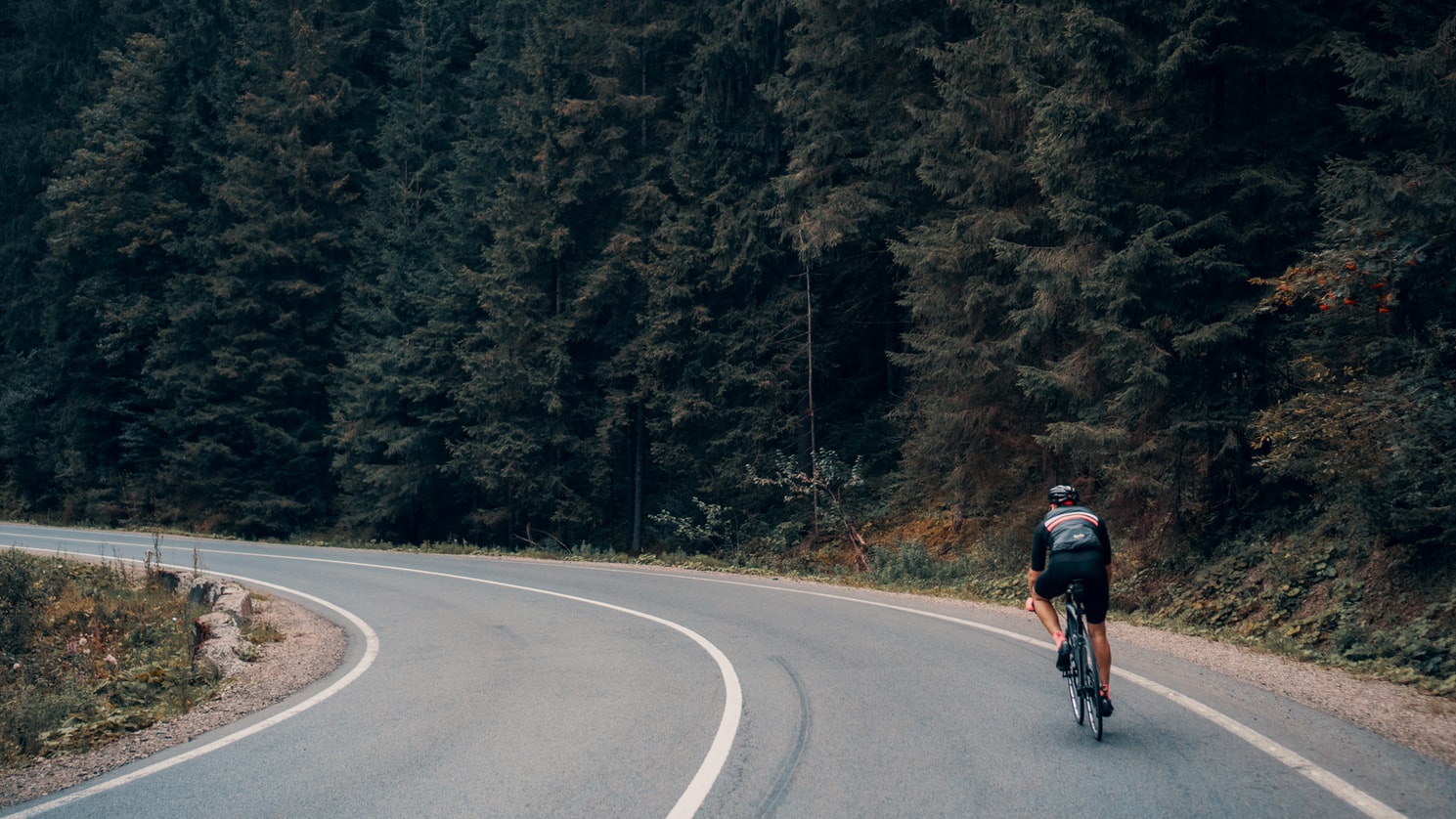 Man cycling through the hills