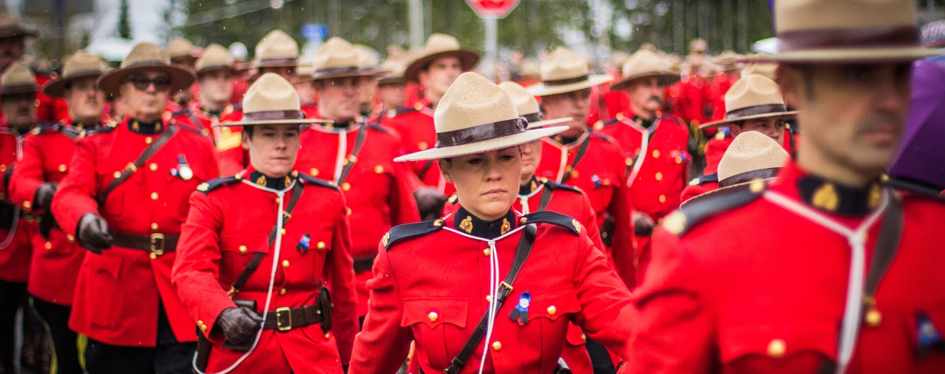 A group of canadian police officers in red uniforms.