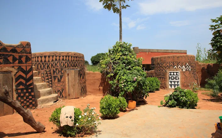 A courtyard with a lot of plants and trees.