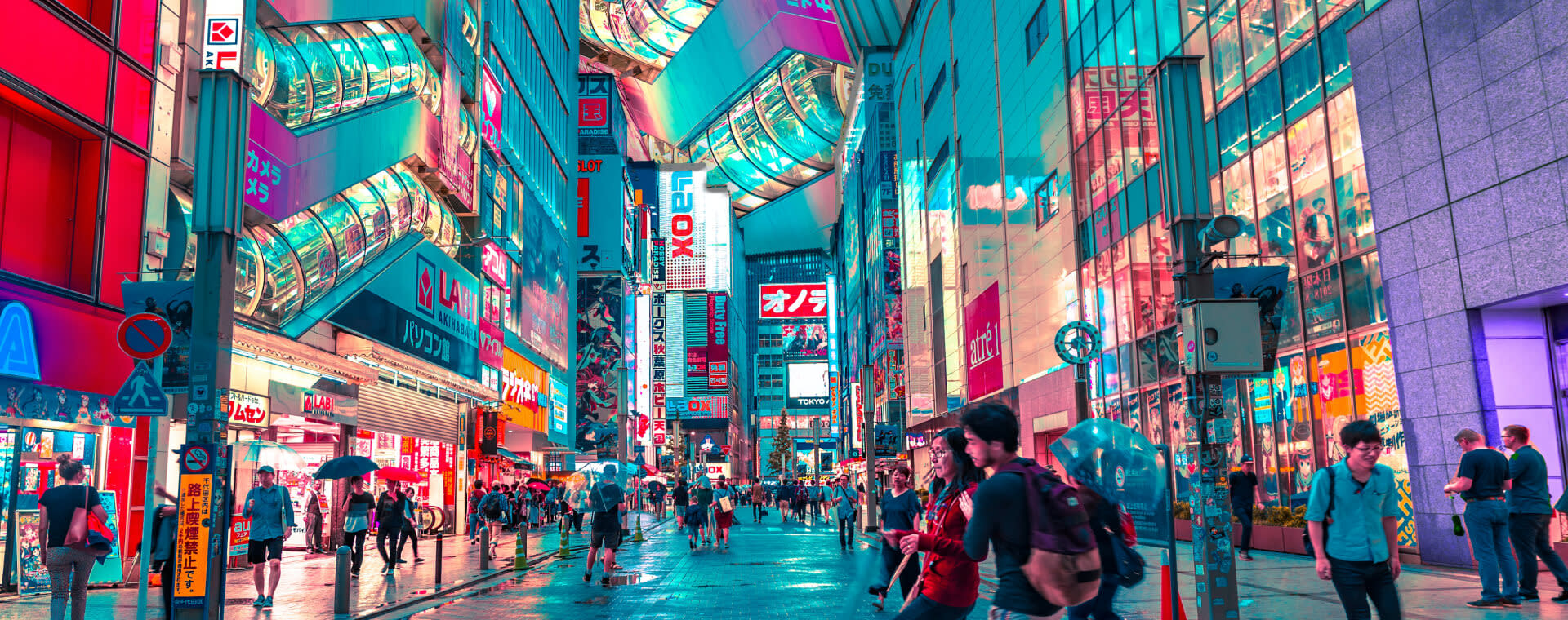 People walking down a street in tokyo.