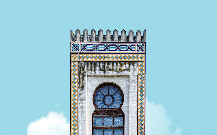 A clock tower with a clock on top of it.