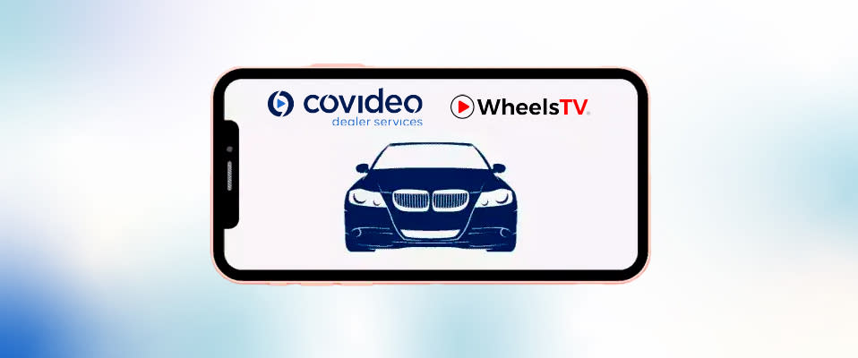 A smartphone turned sideways containing the Covideo and WheelsTV logos over the image of a car on a red background