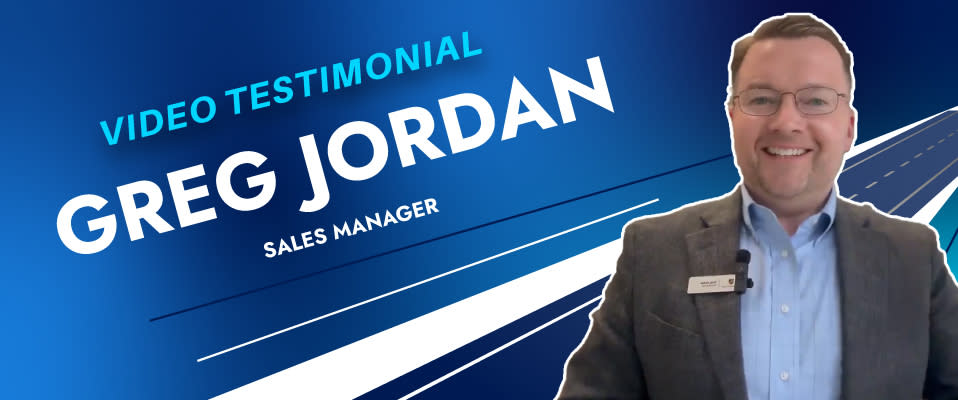 A photo of a man smiling in a suit on a blue background with the words "Video Testimonial, Greg Jordan, Sales Manager"