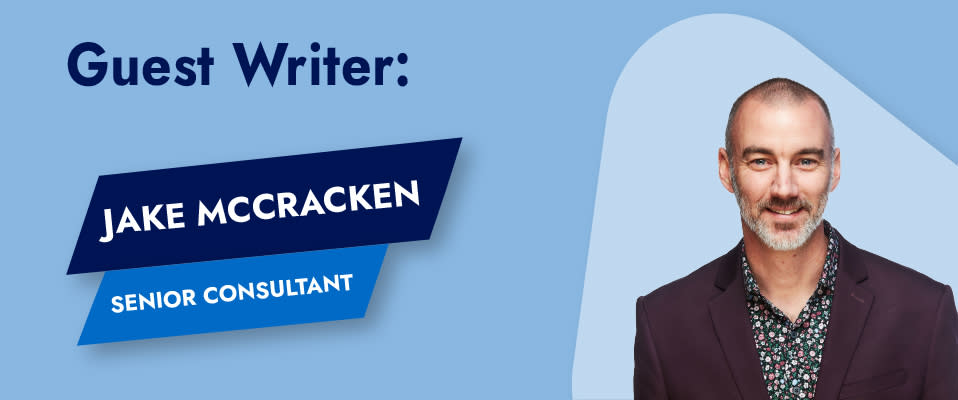 The words "Guest Writer: Jake McCracken, Senior Consultant" next to Jake's headshot, where he is smiling and wearing a suit