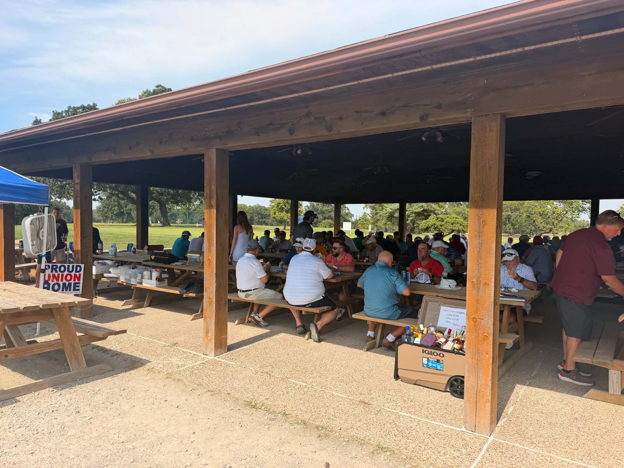 Golfers enjoying lunch after playing a round of golf.