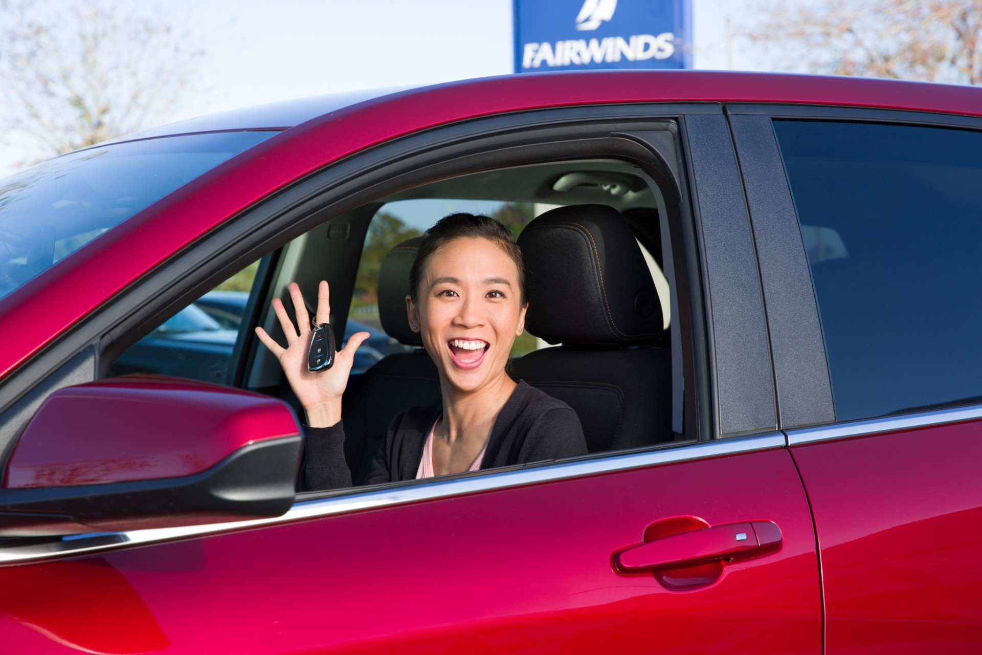 Woman purchasing a new car.