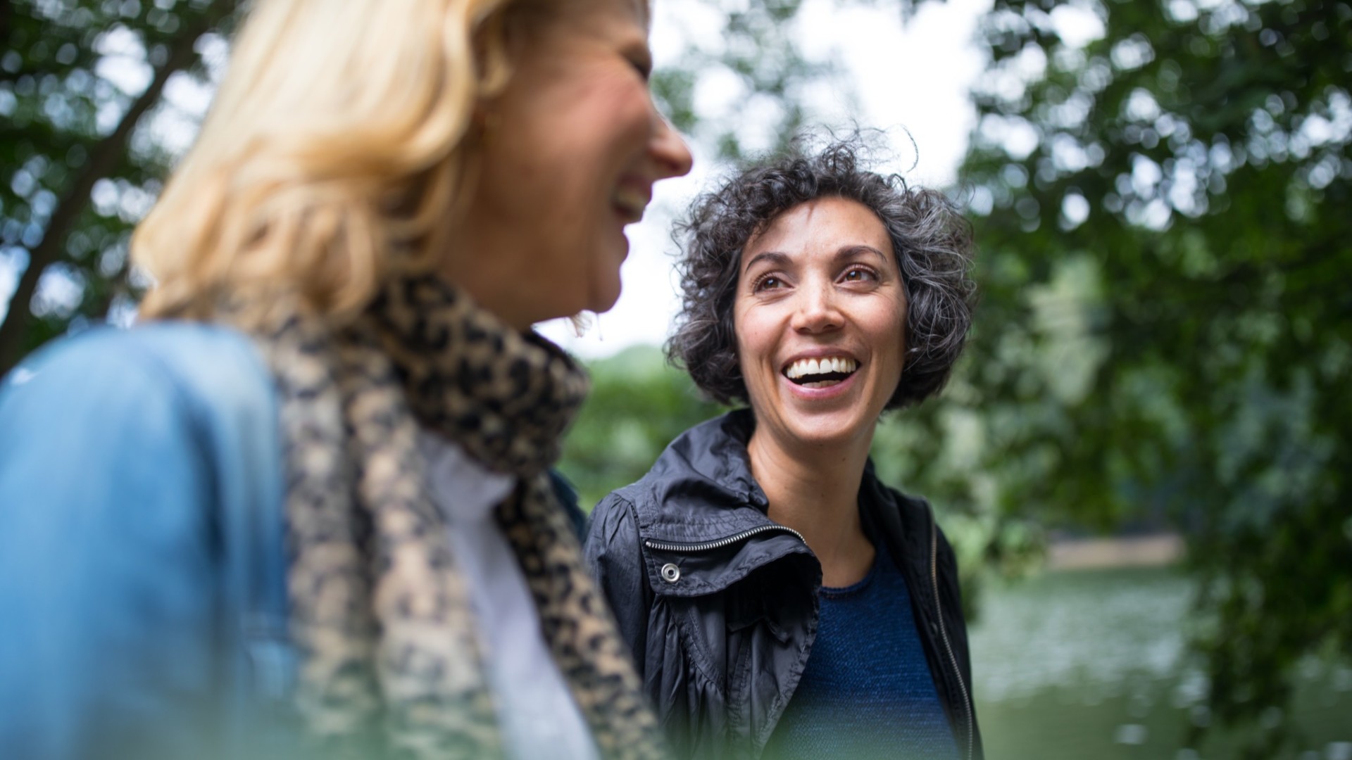 Two women talking to each other. 