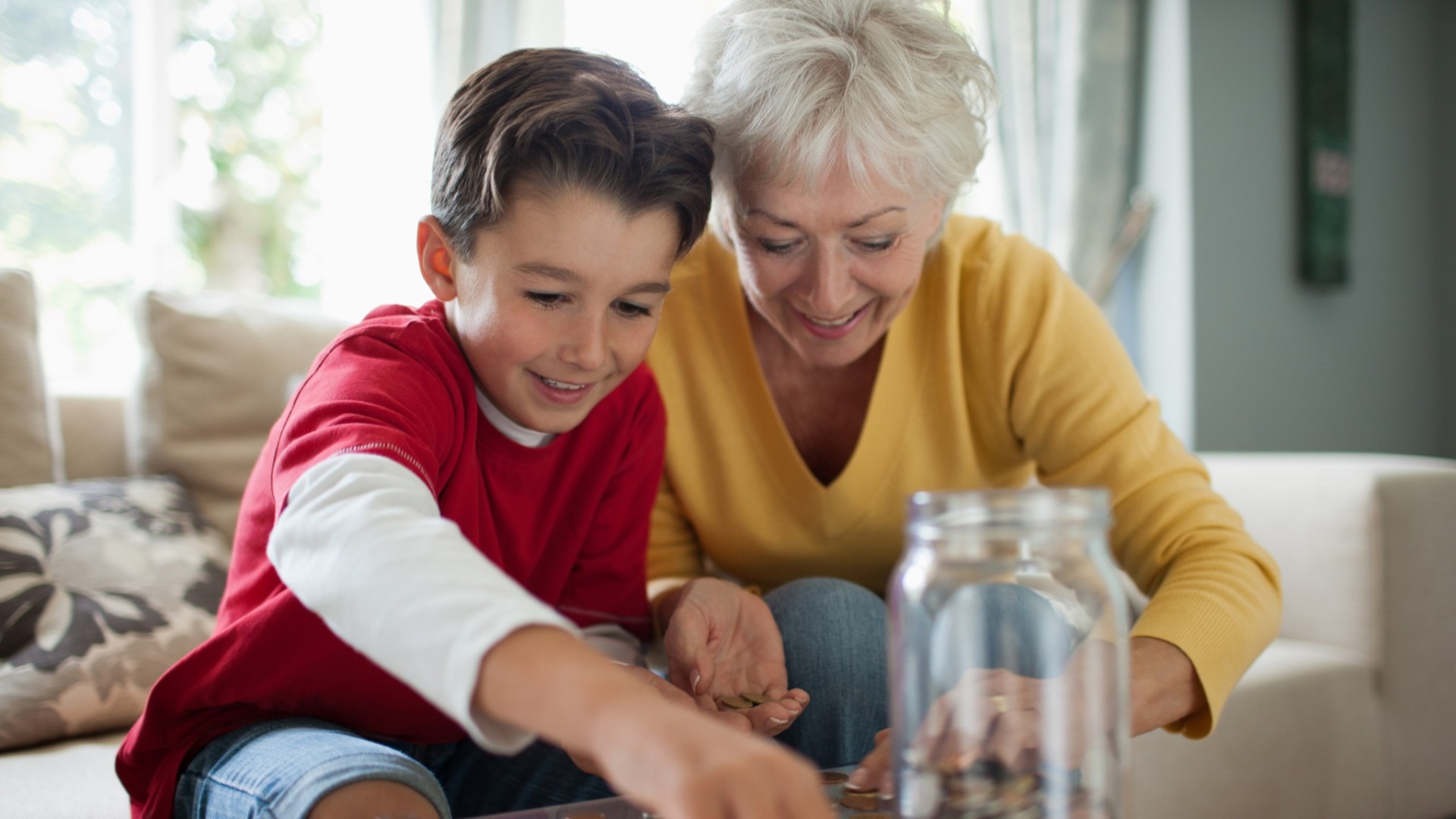 Grandmother teaching grandson about finance.