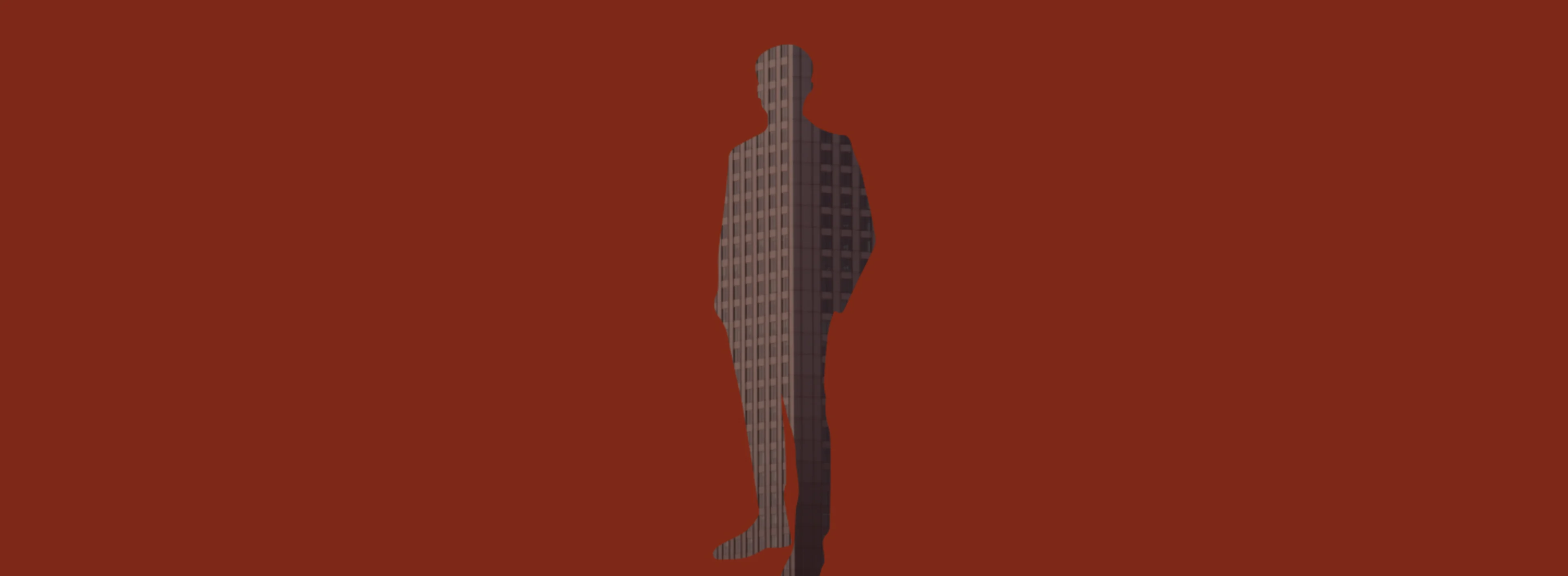 Red background with a man-shaped cutout with a building behind the color block