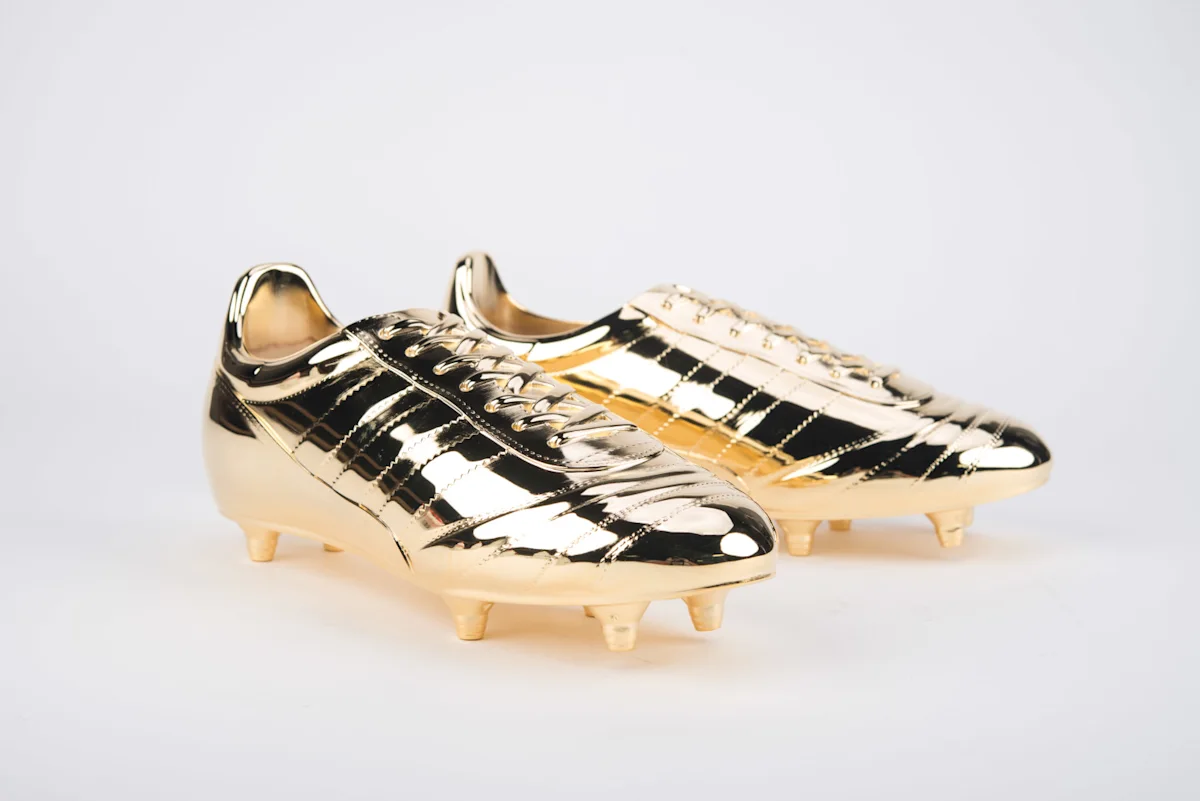 A pair of gold-plated soccer cleats