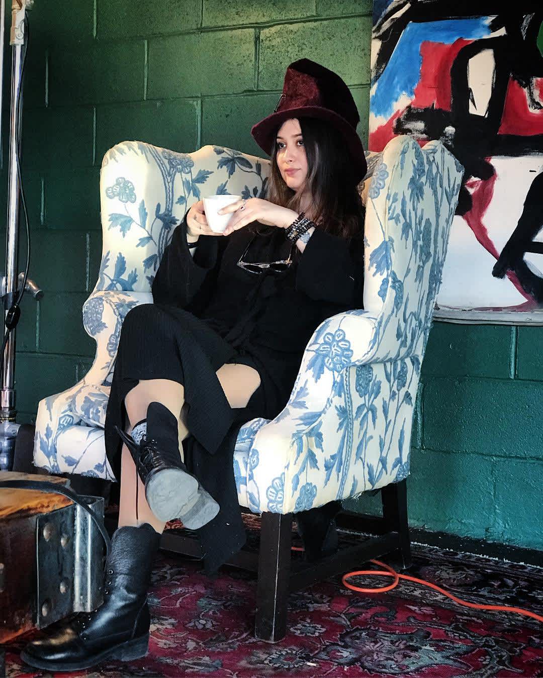 Elizabeth sitting on a chair