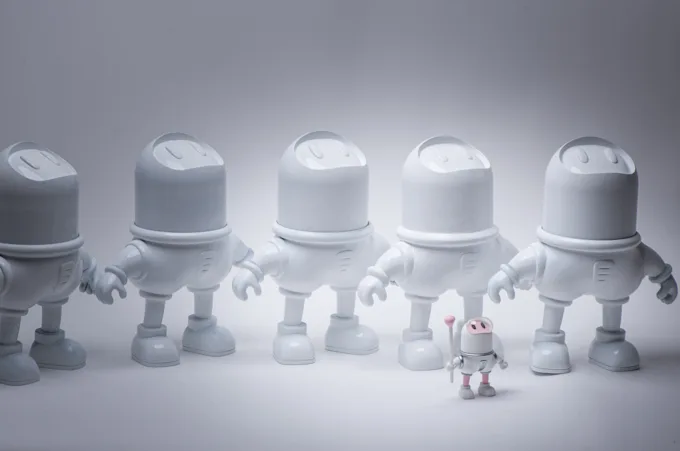 A row of matching unpainted resin astronaut figures from one production run
