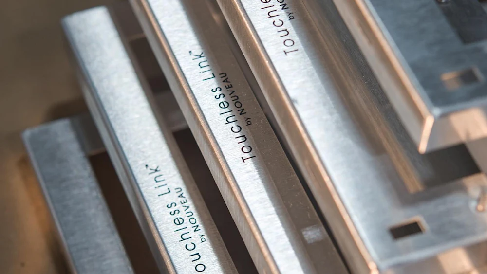 Metal frames engraved by PrintAWorld for Nouveau’s Touchless Link