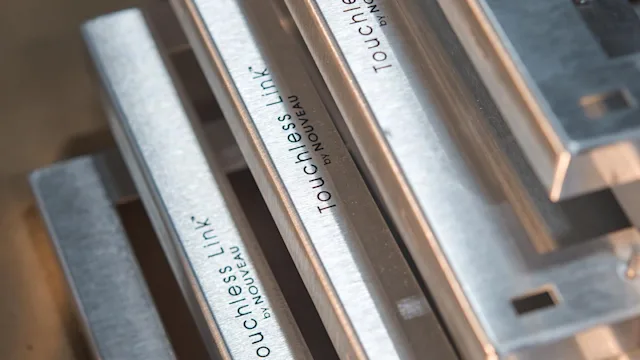Metal frames engraved by PrintAWorld for Nouveau’s Touchless Link