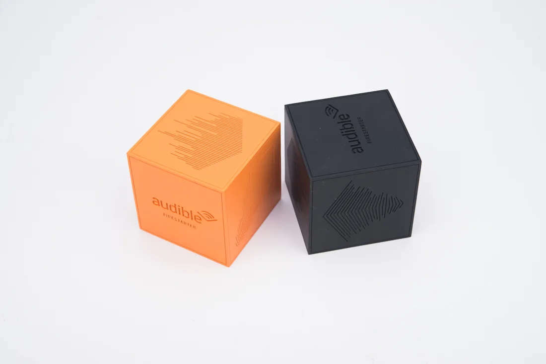 Orange and black painted cube awards for Audible