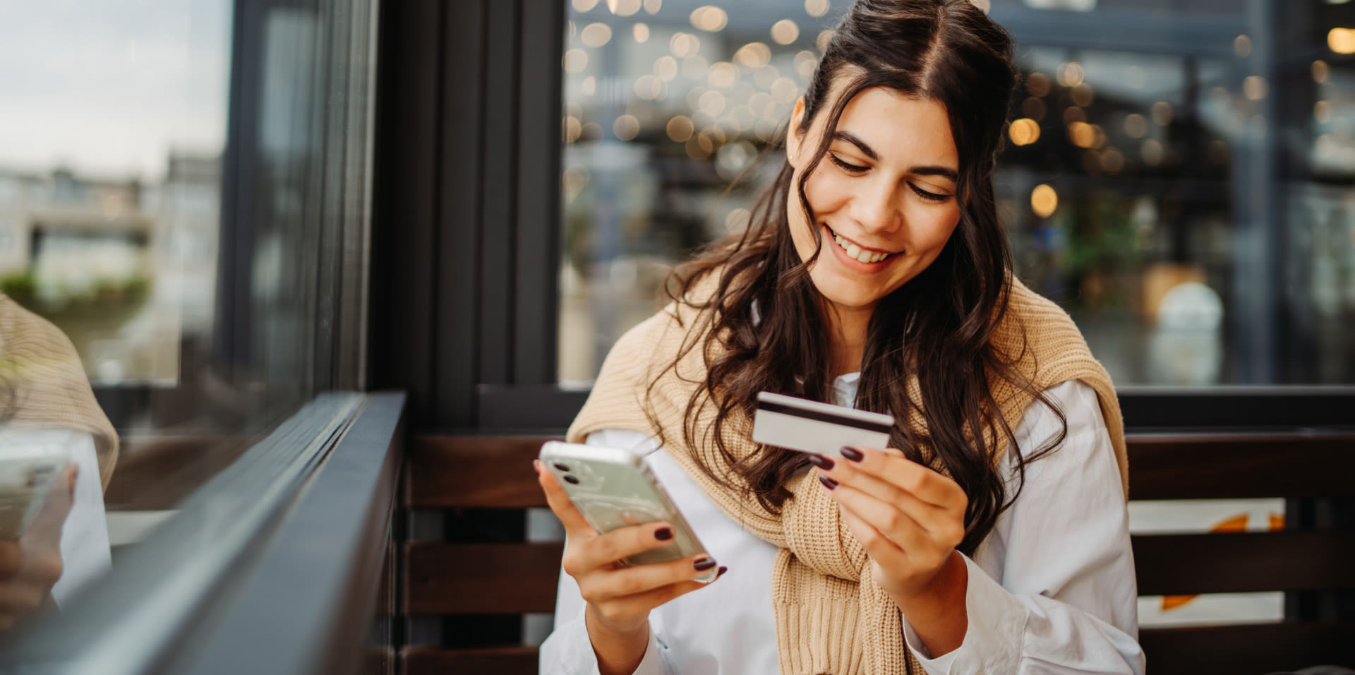 Girl with phone and credit card.