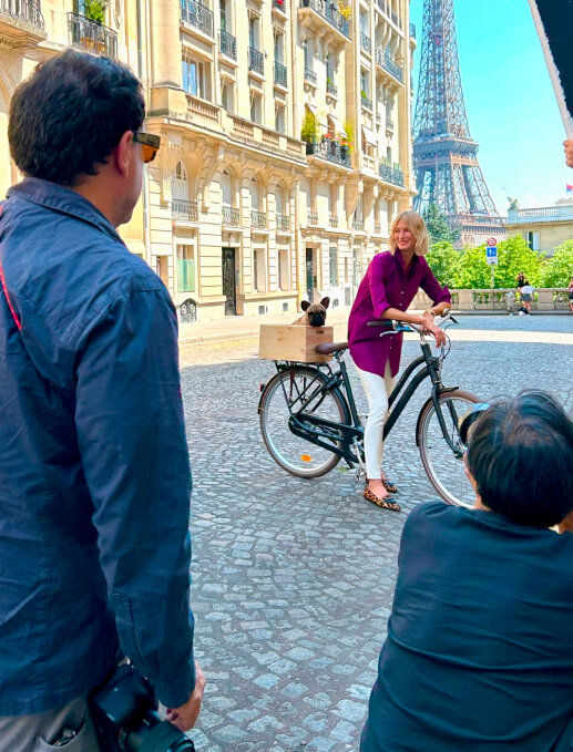 Woman poses on bike in Paris