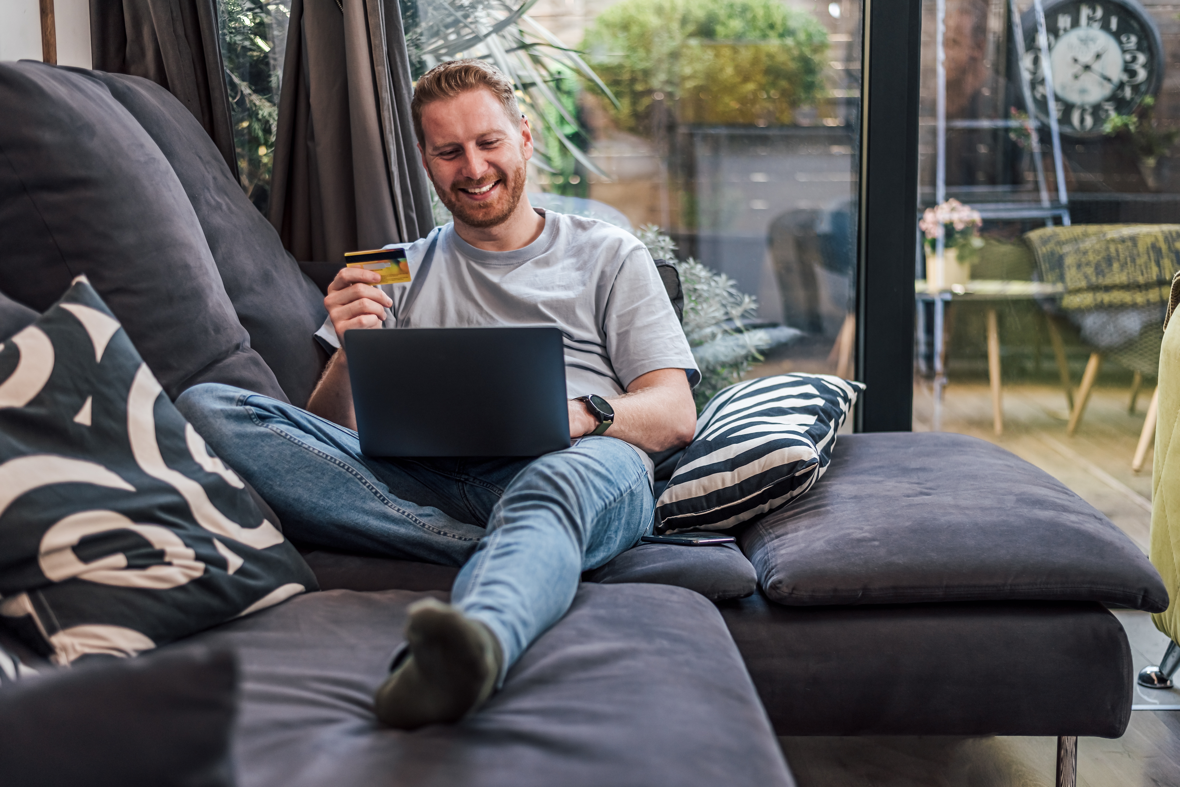 man-couch-laptop