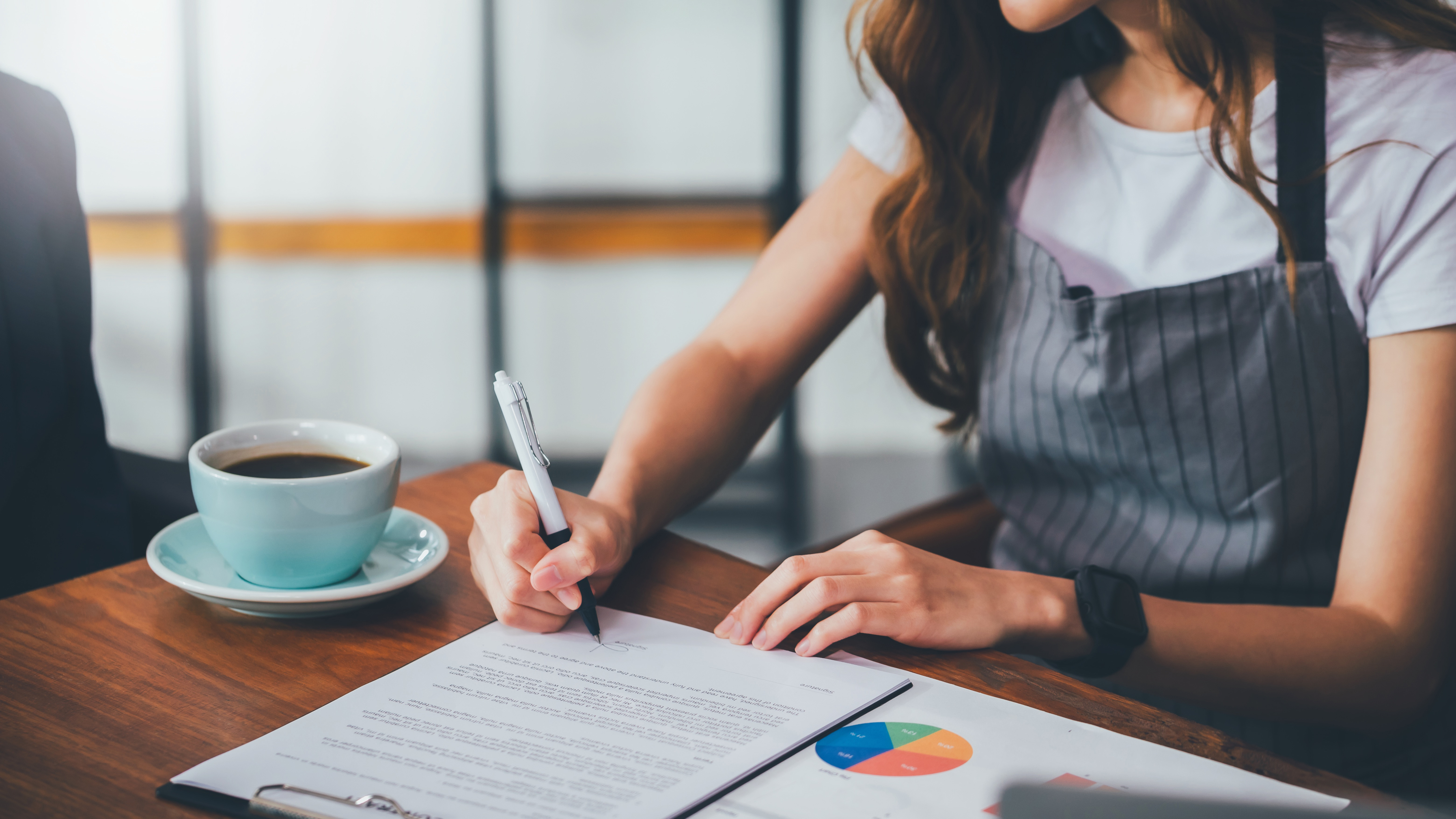 woman-signing-document