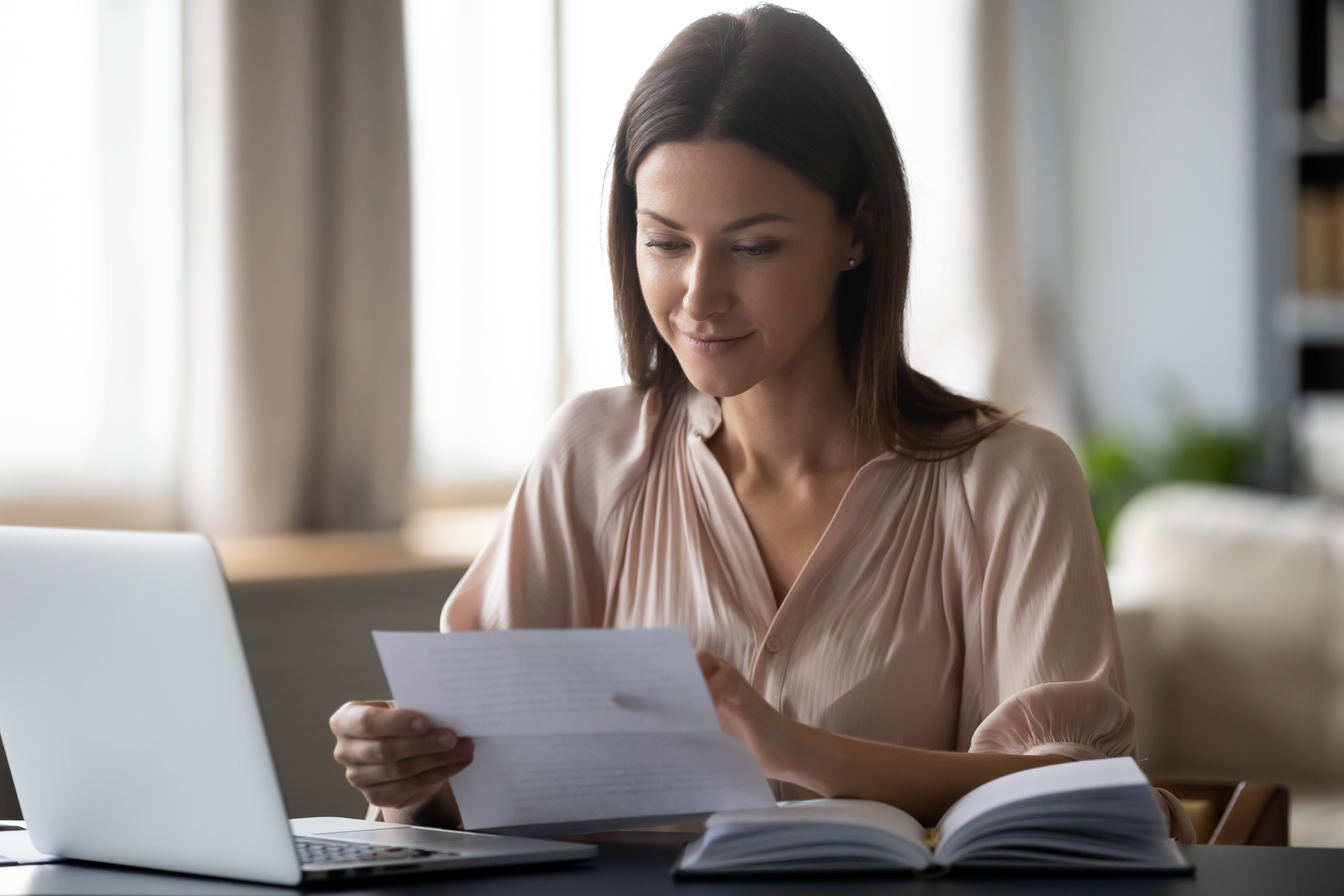 woman-looking-over-paperwork