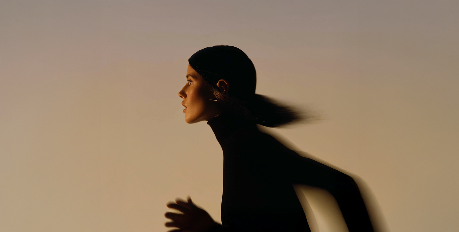 Running woman in the sunset