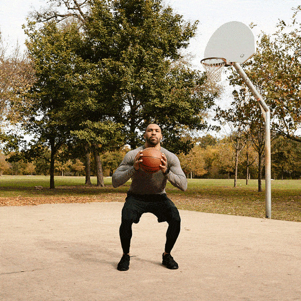 squat jump with basketball