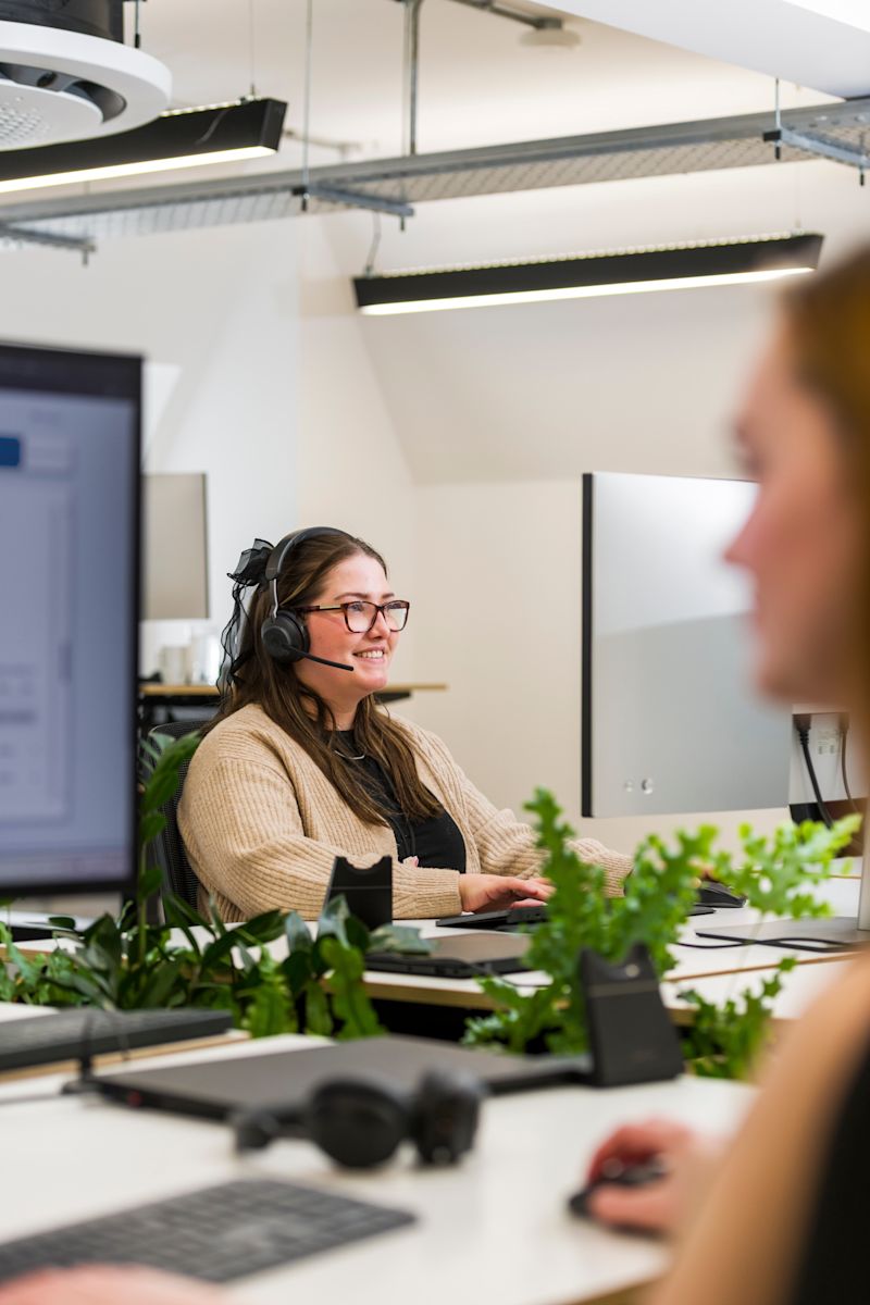 Person on a telephone helping a customer