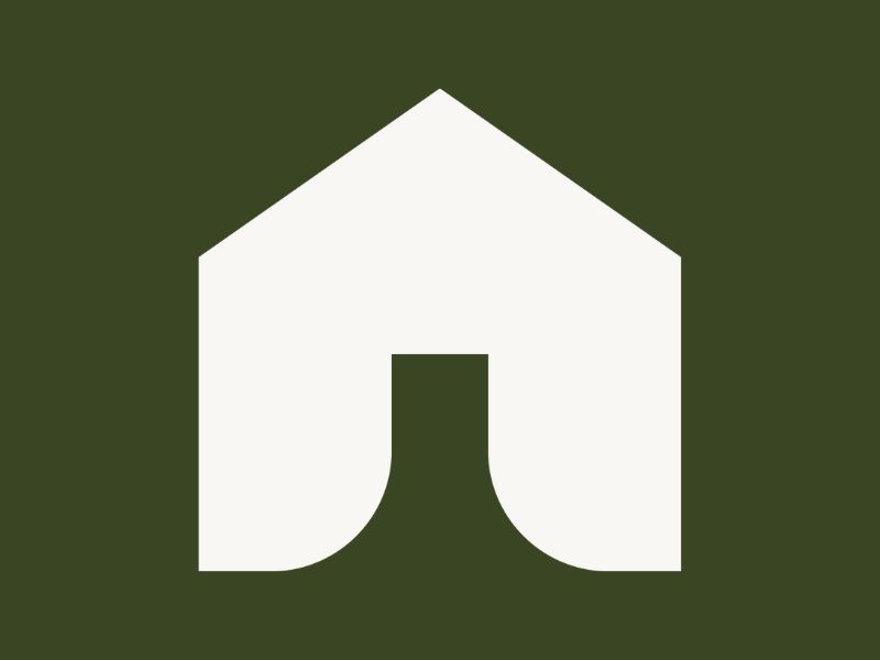 A white house on a green background.