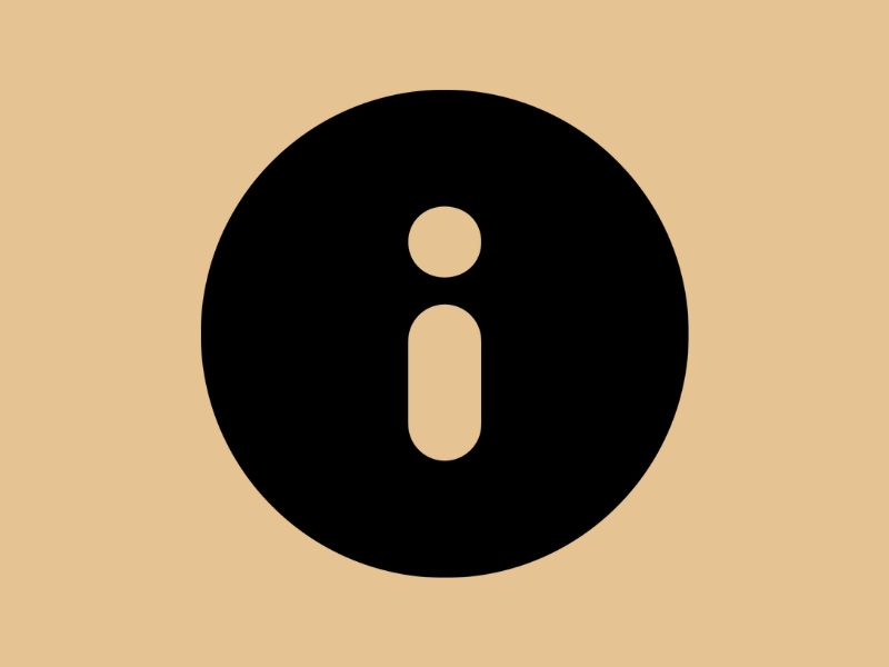 A black information marker on a taupe brown background.