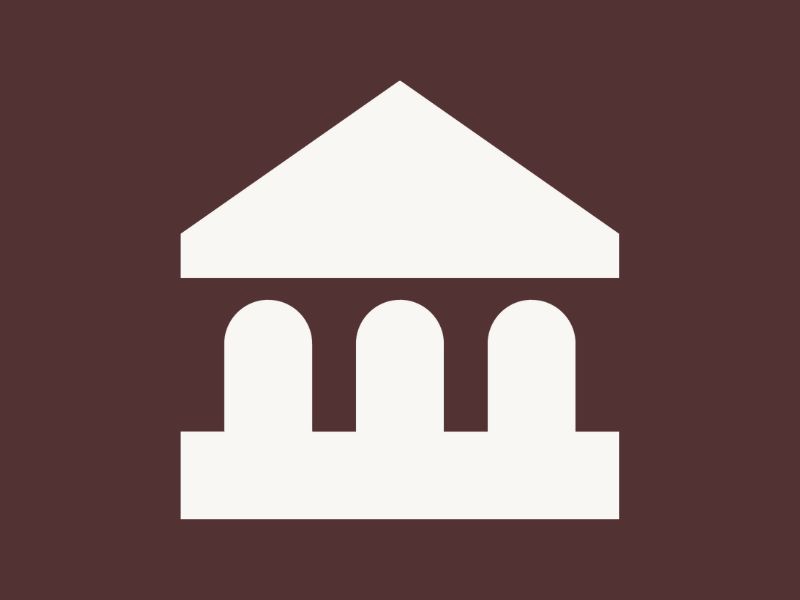 White courthouse icon on a dark earth coloured background.