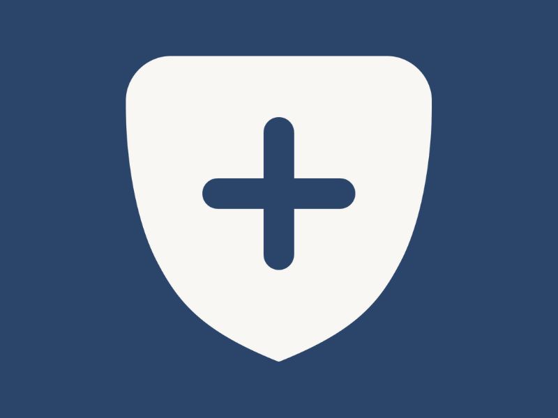 A white shield on a navy blue background.