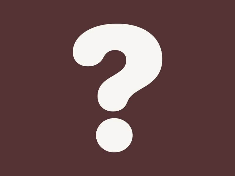 White bold question mark symbol on a dark brown background.