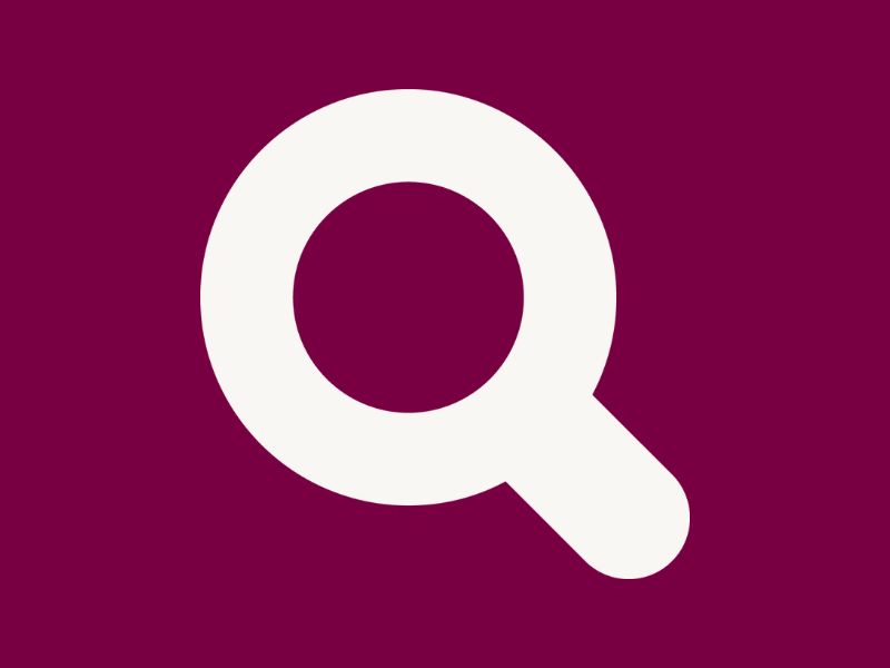 White magnifying glass icon on a plum-coloured background.