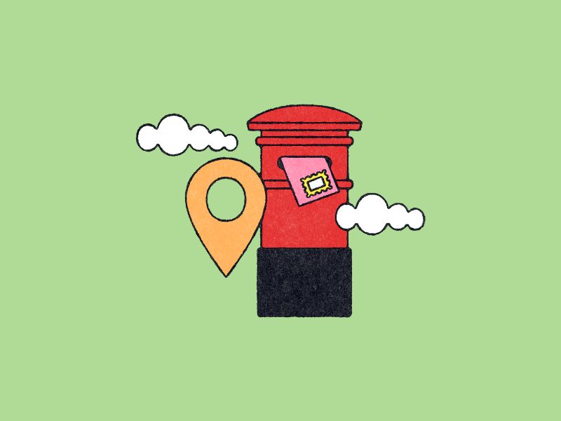 Red postbox on mint background.
