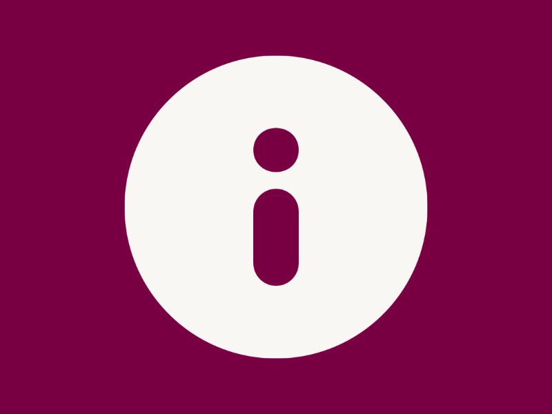 A plum red information marker within a white circle. The white circle is surrounded by the same plum red colour.