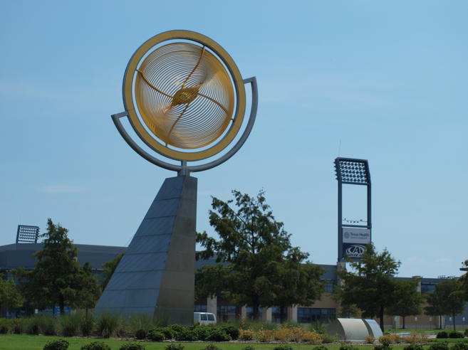 The Healthiest Cities in the United States for Families - Art sculpture in Frisco, TX against a blue sky. 