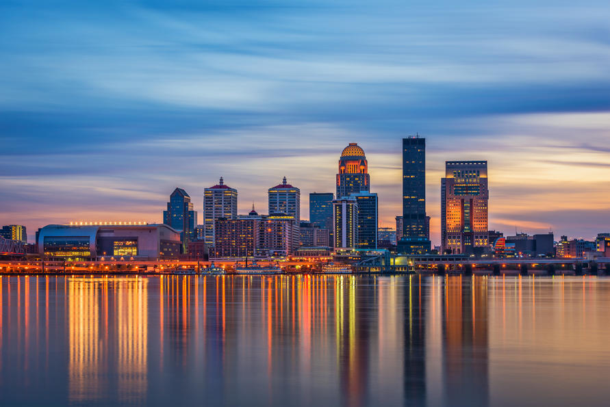 States with the biggest debt problem - Louisville, Kentucky skyline at sunset over the Ohio River. 