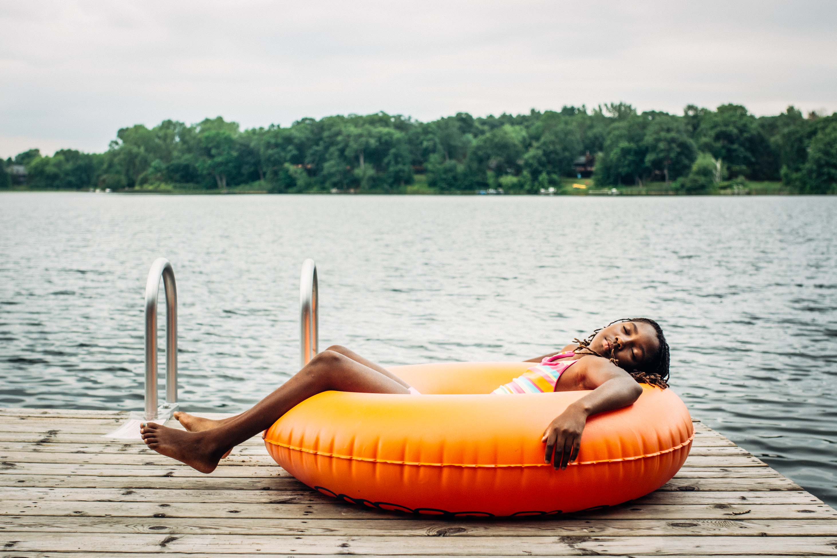 what to know when you have a 9 year old - girl sleeping in inner tube