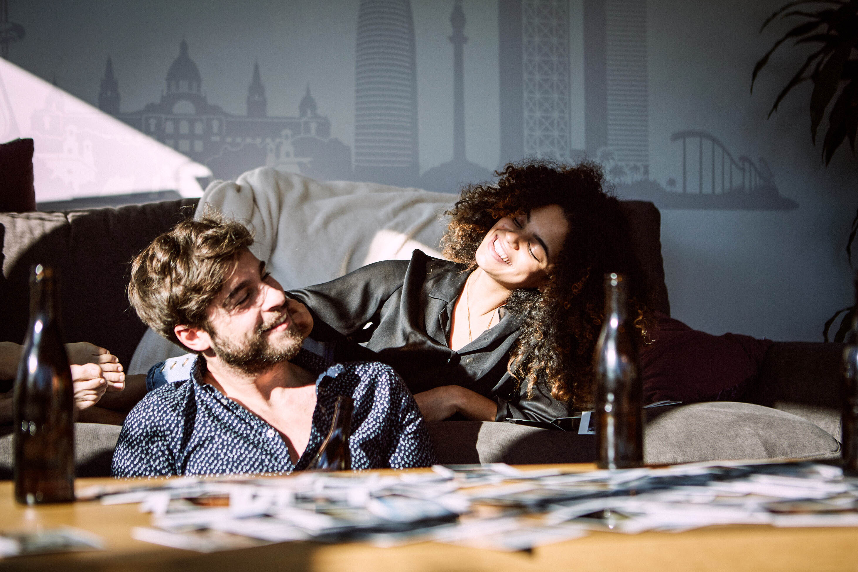 life insurance costs less if you are younger when you buy it - young man and woman hanging out and smiling