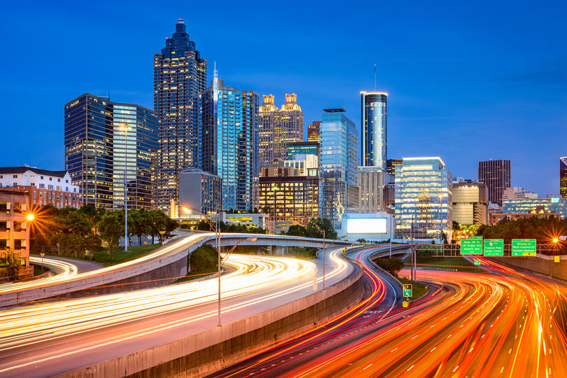 States with the biggest debt problem and Cities With the Hardest-Working Parents- Skyline of downtown Atlanta, Georgia during evening rush hour. 