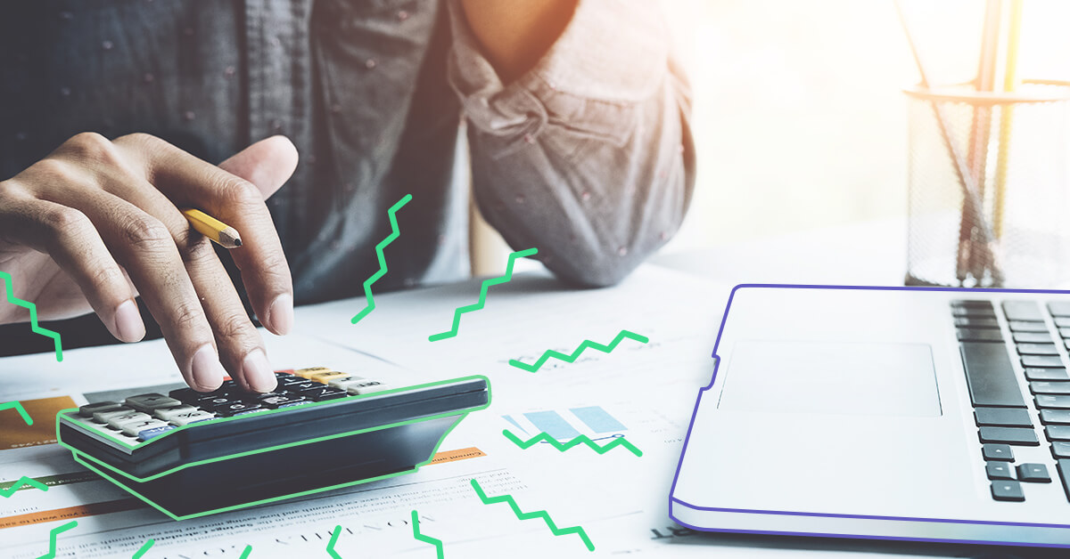 man on calculator and computer - Fabric employees' 2018 financial new year's resolutions