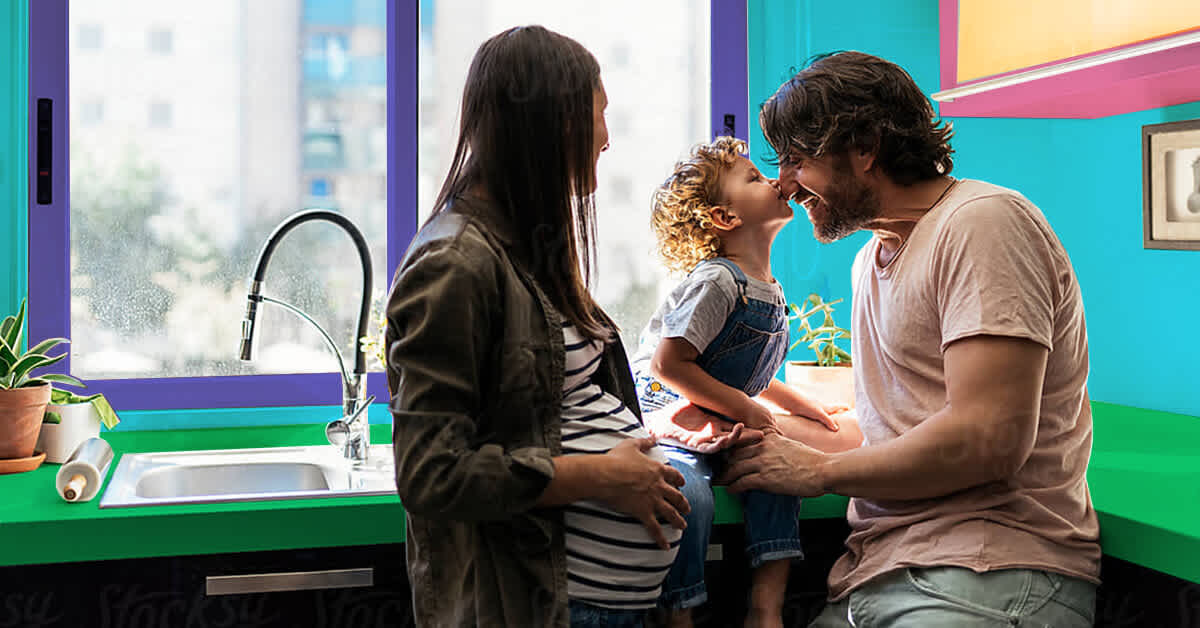 man and pregnant woman with toddler in kitchen - should we have more kids? I want a baby