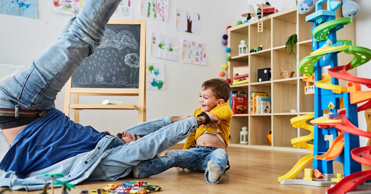 man and boy playing with toys - 5 reasons to get life insurance now