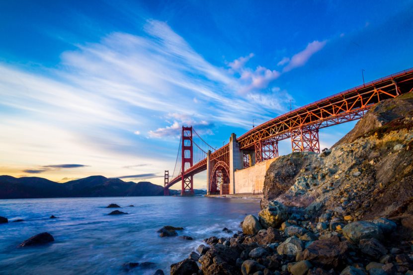 The Best-Paying Cities for Millennials - Calm waters below the Golden Gate Bridge and in the San Francisco Bay during sunrise. 