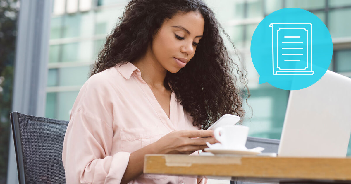 woman at coffee shop on smartphone with computer - how Americans are making a will on their phone, new data from Fabric