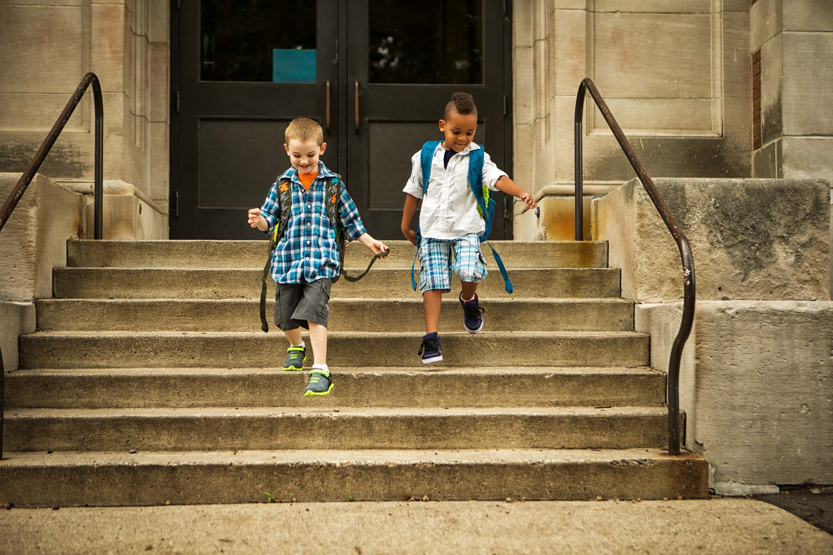 what to know when you have a 5 year old - kids running down school steps