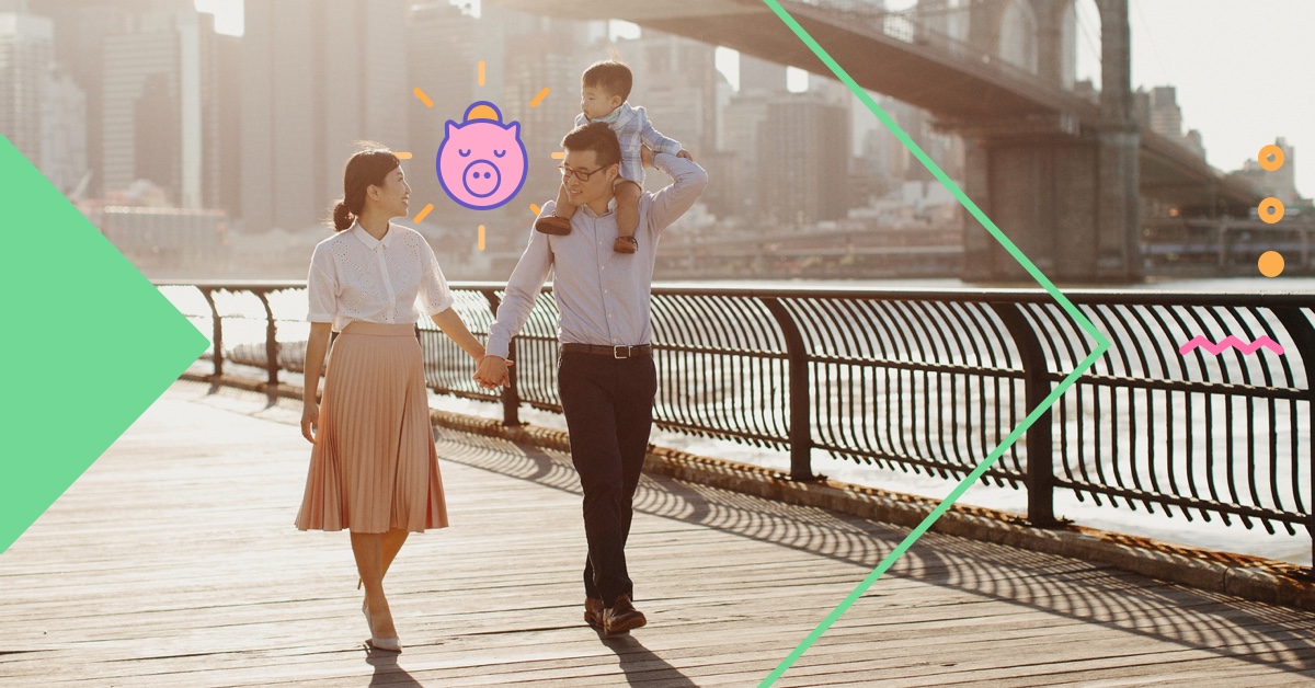 man and woman holding hands with child by Brooklyn Bridge - how to save money when you live in a big city