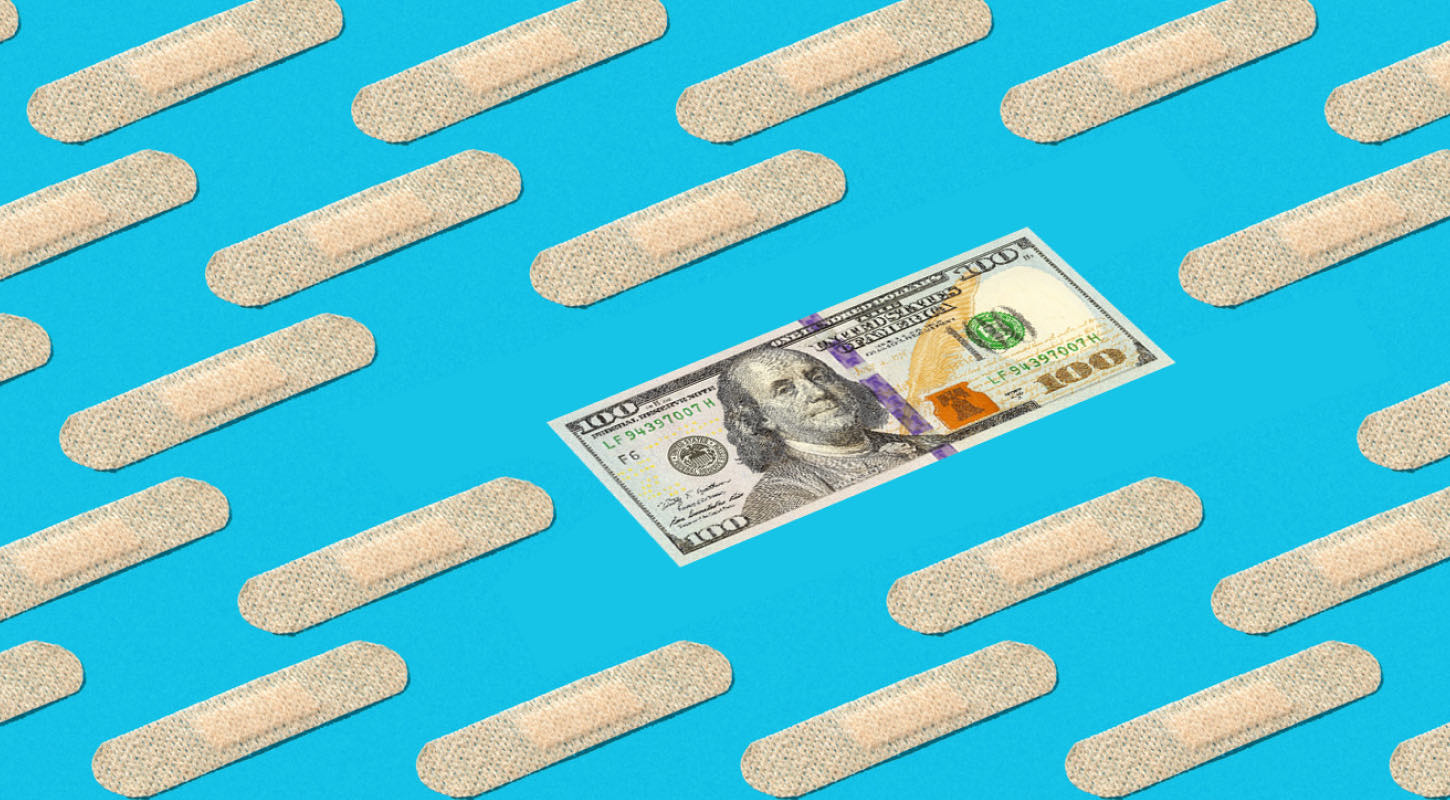 A one hundred dollar bill lays flat amidst multiple bandages. 