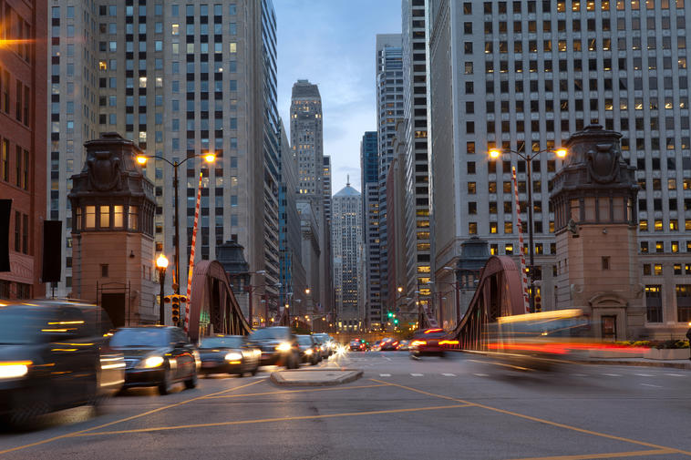 How Much Home Can Millennial Families Afford in These Top Cities? - View of a traffic filled street in downtown Chicago, IL.