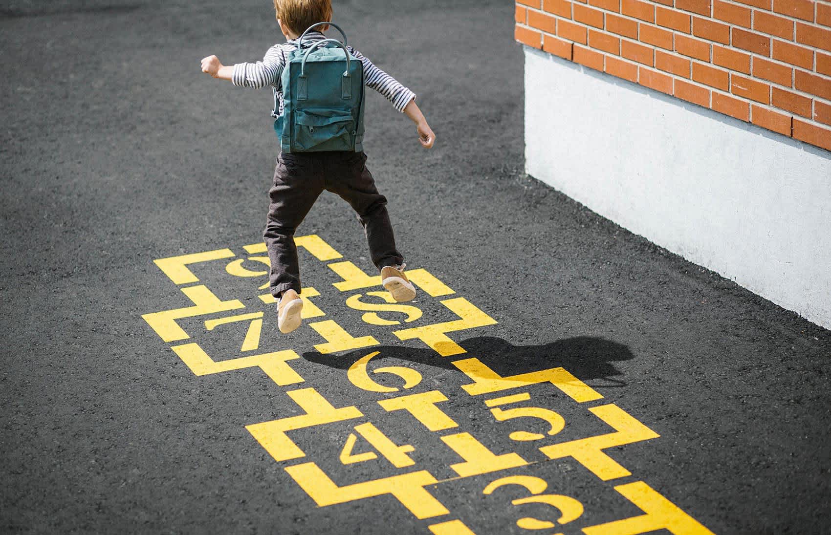 life insurance underwriting 101 - child playing hopscotch